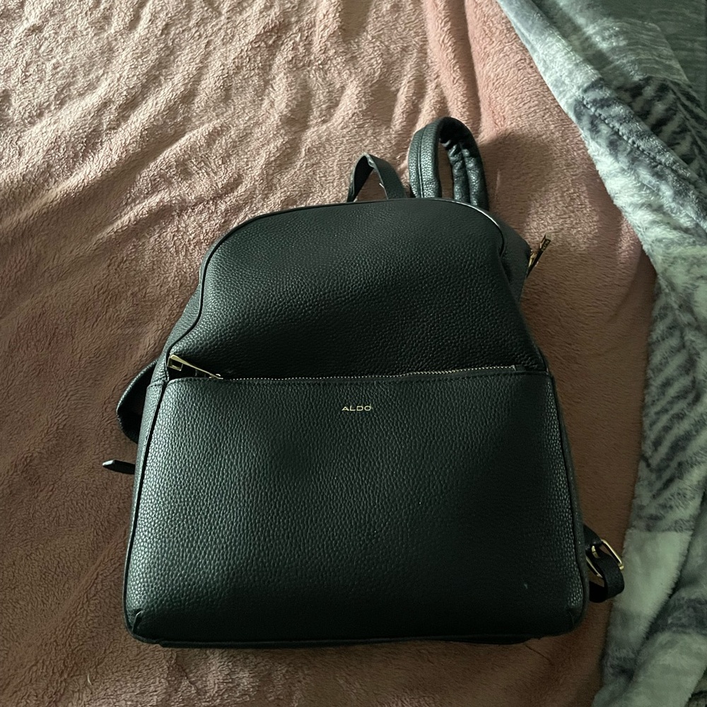 Also leather bookbag
